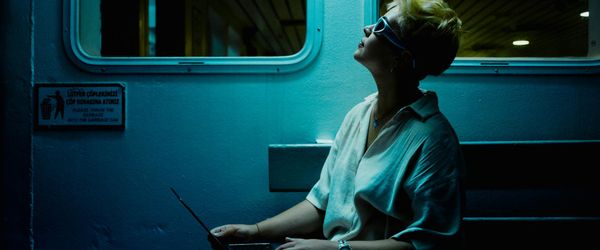 Wide angle of a person moving gracefully in silhouette.